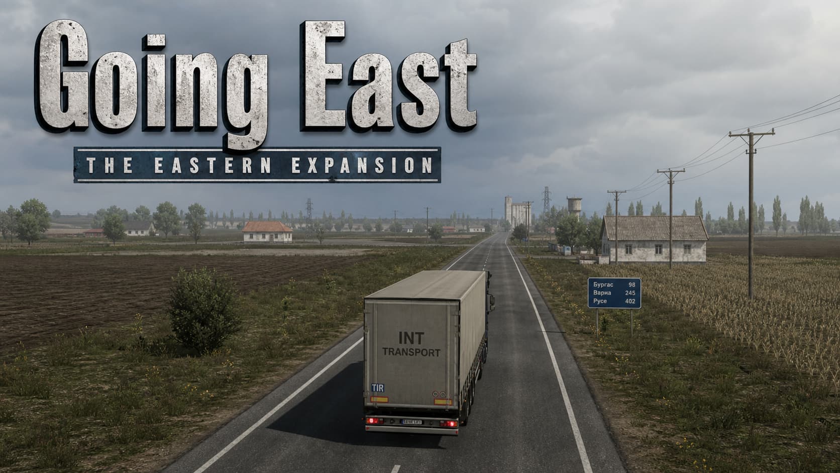 Un camion circulant sur une route droite traversant une plaine d’Europe de l’Est, entouré de champs et de bâtiments simples, avec un style graphique de jeu vidéo du début des années 2010 et le texte superposé